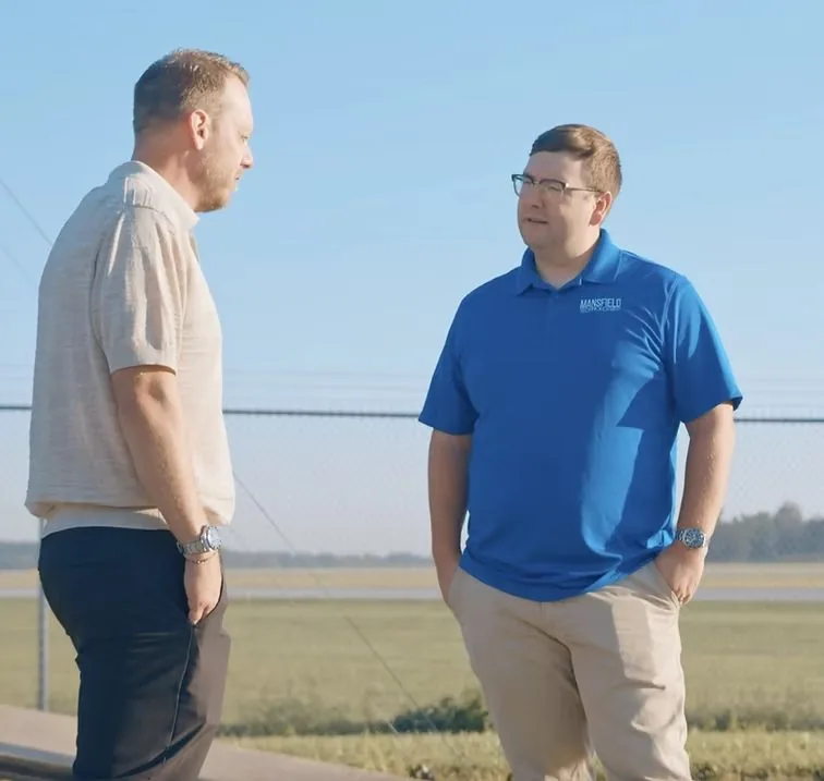 Chris McDevitt in conversation with a client outside a secure facility